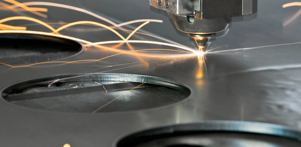 Portland laser cutting service image of machine cutting metal at Bridge City Steel